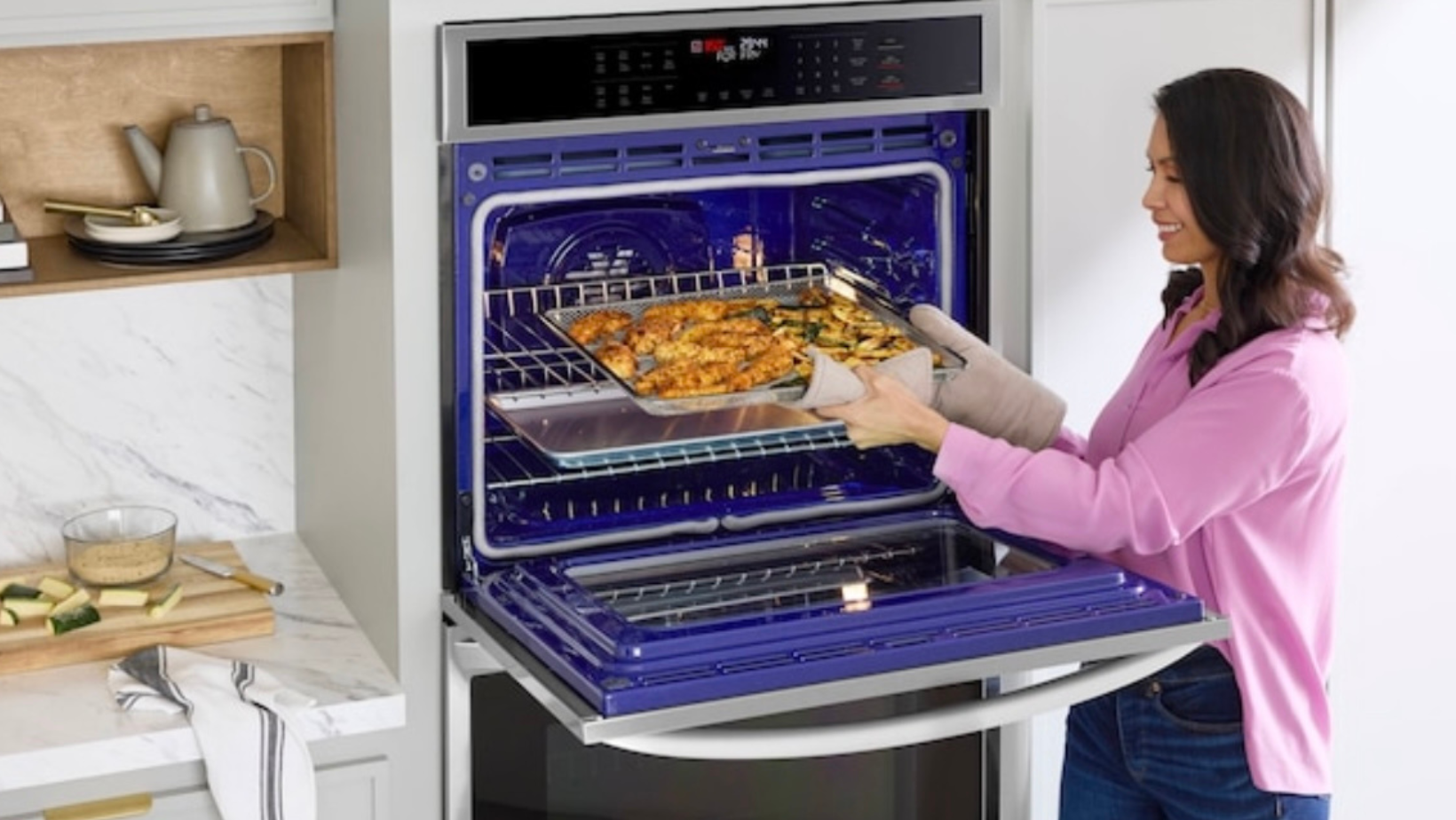 woman cooking with double oven